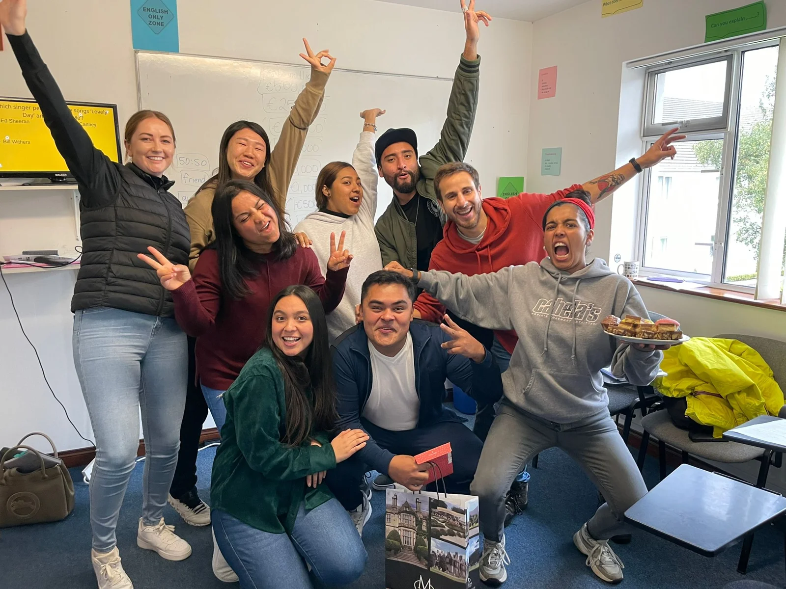 Adult students celebrating together in class