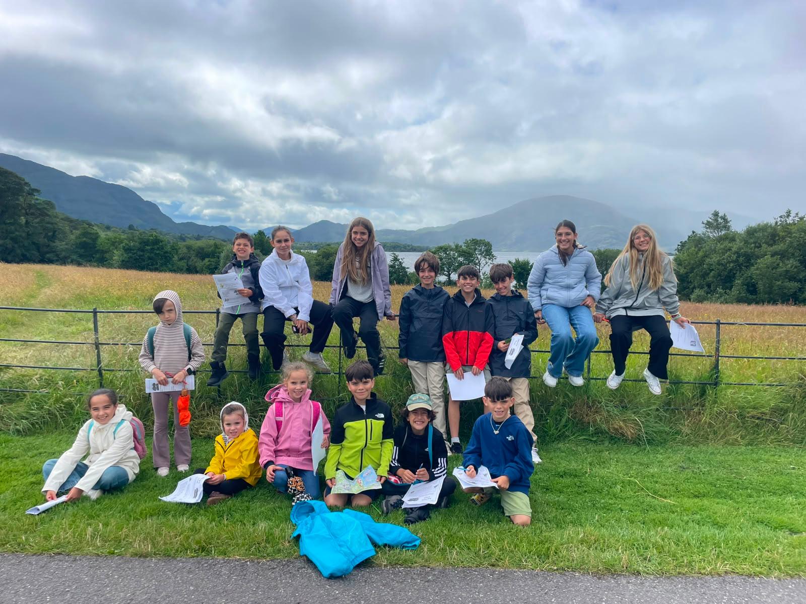 Children on an outing beside the lakes and mountains